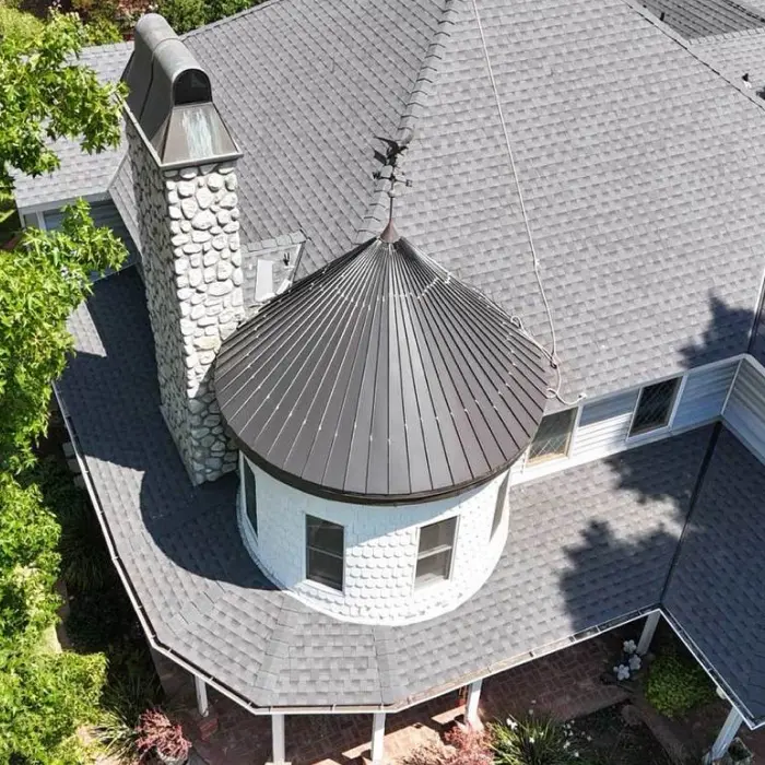 Gray shingle roof with turret