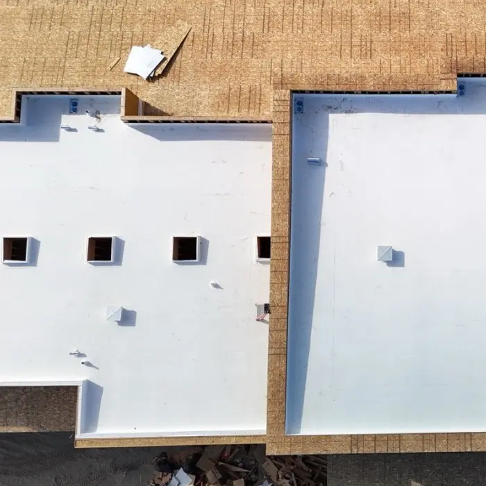 Aerial view of flat rooftop with roof coating