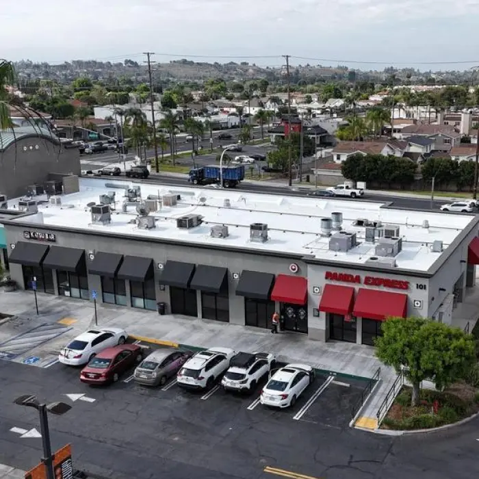 Shopping plaza with parked cars
