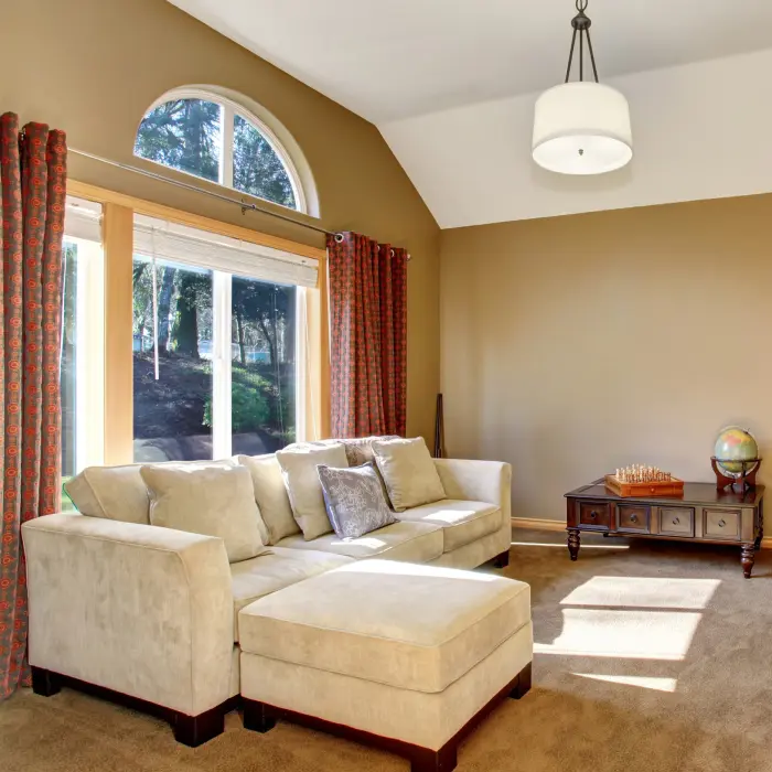 Living room with cozy carpet and wonderful lighting.