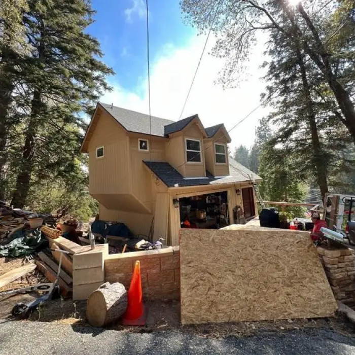 House on hillside driveway