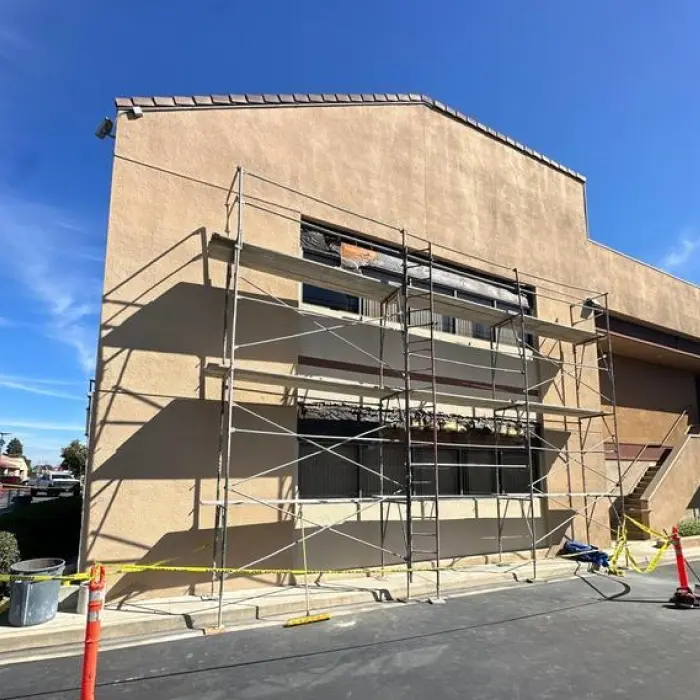 Scaffolding on beige building facade