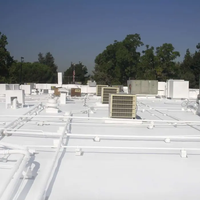 White rooftop with HVAC units and roof coating